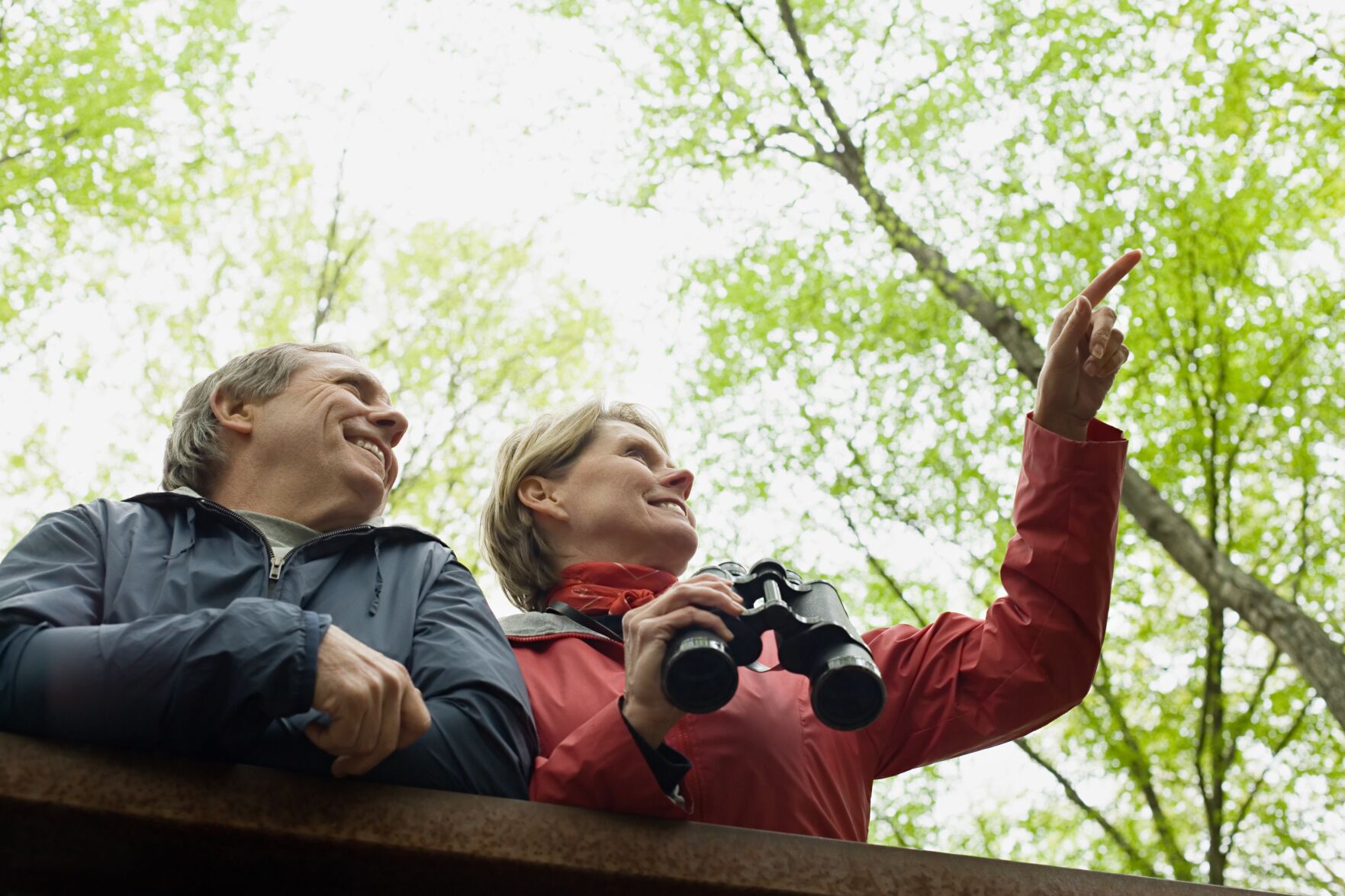 Mature couple with binoculars